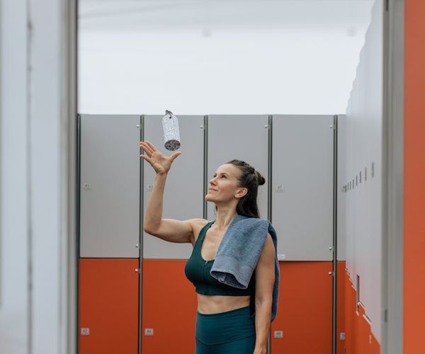 Sports bag with a water bottle and a towel, ready for a workout.